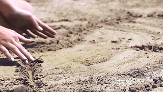 Russian blonde MILF strips nude at beach