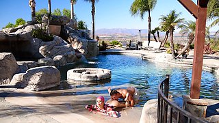 A hot brunette with big natural boobs has fun by the pool with her boyfriend.