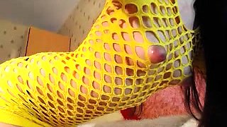 Attractive brunette in fishnets shows off her huge nipples