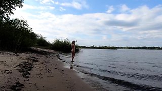 Exhibitionist Blonde Goes Nude on a River Beach