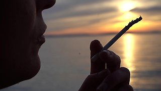 Smoking Cigarettes on the Beach