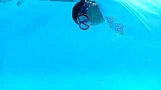 Couple Underwater Diving and Swimming