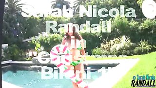 Sarah Randall poses poolside in holiday bikini