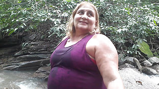 My friend naked at the waterfall