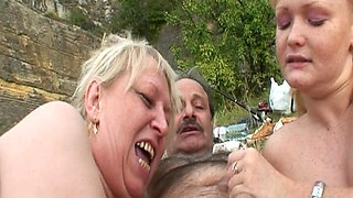 Busty Granny and Teen Pleasing a Dick Outdoors