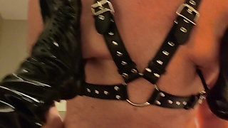 Mistress Digs the Heels of Her Boots Into Her Slave