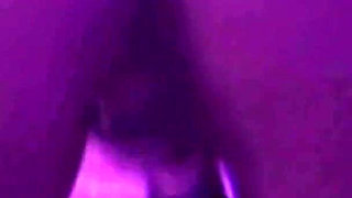 Young Girl Using Her Feet to Play with the Dildo While Masturbating