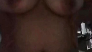 Squeezing the breasts after showering