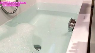 hidden cam unaware MILF in the bath