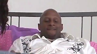 A black girl with huge natural tits gives a blowjob to a black cock that cums in her mouth