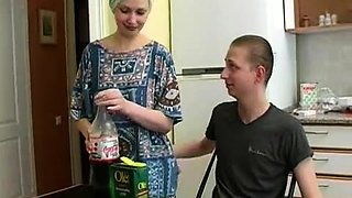 Young stud fucking a sexy Russian housewife in the kitchen