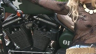 Stunning blonde MILF at outdoors photo shooting