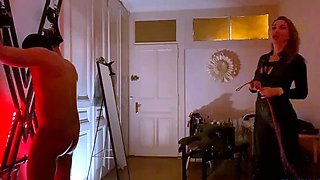 Merciless MILF mistress spanking her slave into submission