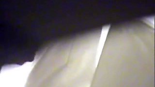Amateur voyeur's camera recording bushy cunt taking a leak