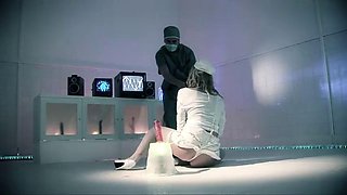 Busty blondie in a straightjacket has hot threesome with two doctors
