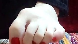 Cute teen girl enjoys foot fetish
