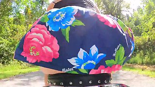 Butt plugged wife rides bike in the park and shows her toy
