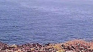 Couple Is Hiking Naked Near the Coast