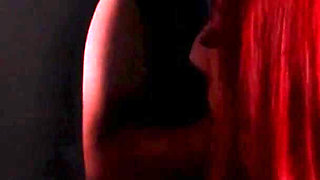 Redhead nurse sucks cock at a gloryhole