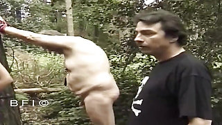 Tied up milf gets punished outdoors