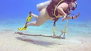 Bizzare sex session during SCUBA diving. She takes a huge cock while being 100m underwater