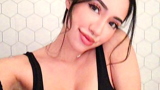 Busty babe playing with her big boobs