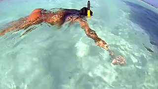 topless russian swimming in tropical sea