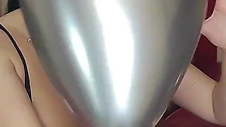 Valentine's Day. Blowing and Popping Balloons