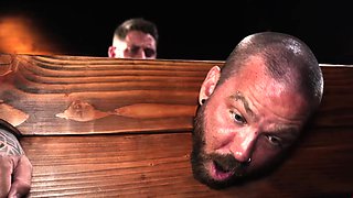 Jayson Parker bound and gagged on top of a table