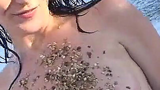 Busty Adrianne Playing on Beach.