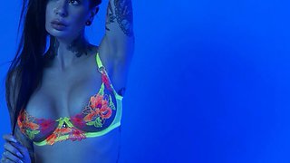 MILF slips out of her sexy neon lingerie