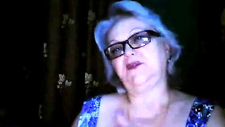 Russian granny ex-teacher flashing her big tits on  webcam