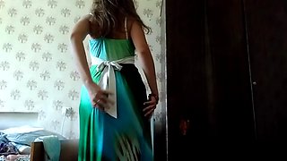 In the sanatorium on the fridge and afterwards on the bed in a very long green dress, sucking dildo