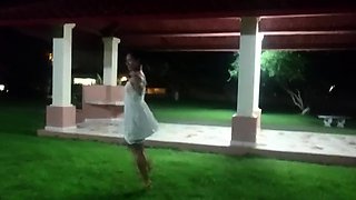 Tiny-titted Asian babe plays with herself outdoors