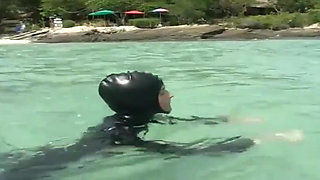 Girls in latex on the beach