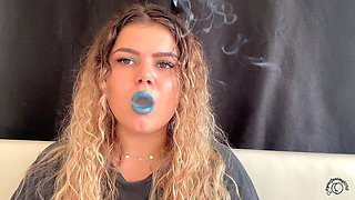 Exotic Goddess with Wild Hair Blows Smoke for You