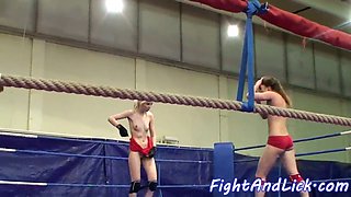 Watch these sexy lezzie babes devour each other's shaved pussies in a wrestling ring