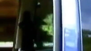 A horny young couple has sex in a car in the middle of nature