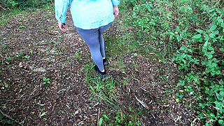 Completely naked in the field banging her breasts