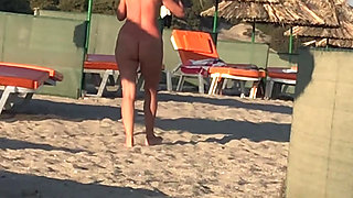She pisses on the nudist beach