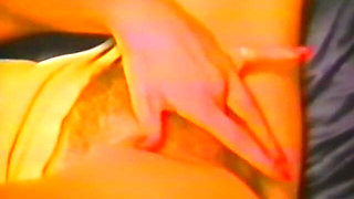 A teasing brunette uses fingers and a dildo