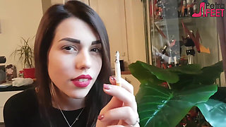 Smoking in close up with a beautiful girl