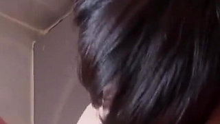 Asian sucking cock in the bathroom
