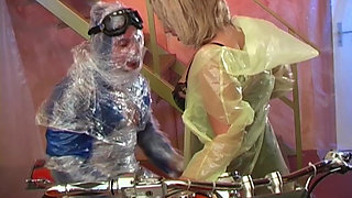 Blonde MILF in Raincoat Sucks Plastic Wrapped Cock