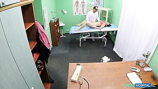 Fake doctor examines a patient in a pink bra