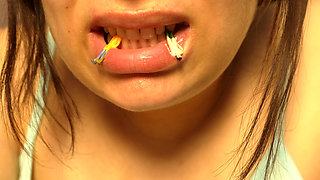 Giantess Girl Unwraps a Candy but Is Surprised Because There Is a Tiny Man in the Candy Bag - She Is Curious to See What It