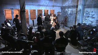 Strapped slave group caned in public