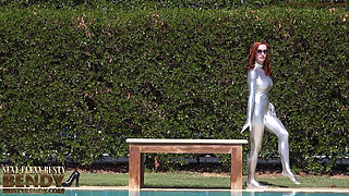 Bending in a Silver Spandex Suit