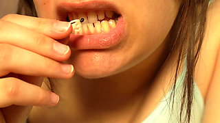 Giantess Girl Unwraps a Candy but Is Surprised Because There Is a Tiny Man in the Candy Bag - She Is Curious to See What It