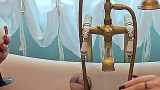 Two Busty MILFs Play with Each Other and Pour Milk Over Each Other's Bodies in the Bathtub.